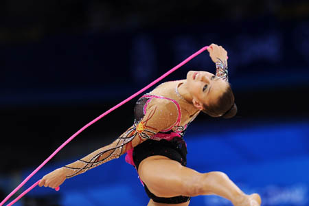 Evgeniya Kanaeva of Russia competes during the individual all-round final at the Beijing 2008 Olympic Games rhythmic gymnastics event in Beijing, China, Aug. 23, 2008. Evgeniya Kanaeva won the gold medal of the event. (Xinhua/Cheng Min) Evgeniya Kanaeva of Russia competes during the individual all-round final at the Beijing 2008 Olympic Games rhythmic gymnastics event in Beijing, China, Aug. 23, 2008. Evgeniya Kanaeva won the gold medal of the event. (Xinhua/Cheng Min)