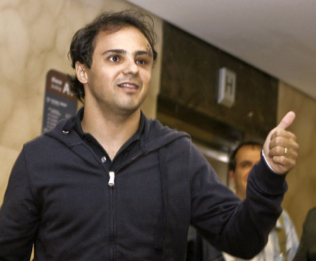 Brazilian Formula One driver Felipe Massa of the Ferrari team gives the thumbs up as he arrives at a hospital in Sao Paulo August 3, 2009. Massa suffered a head injury on July 25 at the qualifying for the Hungarian Grand Prix and spent several days in a coma and on a respirator. Brazilian Formula One driver Felipe Massa of the Ferrari team gives the thumbs up as he arrives at a hospital in Sao Paulo August 3, 2009. Massa suffered a head injury on July 25 at the qualifying for the Hungarian Grand Prix and spent several days in a coma and on a respirator.