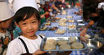 Children make moon cakes to greet Mid-Autumn Festival
